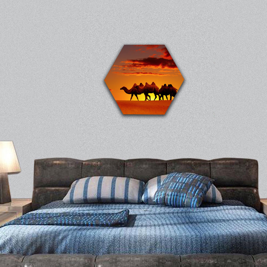 Desert landscape with walking camels at sunset hexagonal canvas wall art