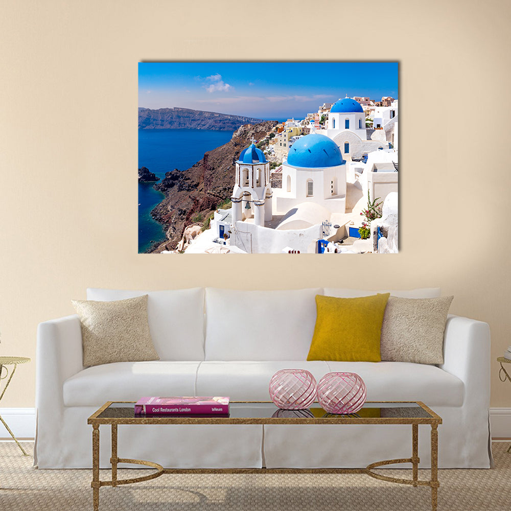 Panoramic scenic view of beautiful white houses and blue domes in Oia, Santorini, Greece Multi Panel Canvas Wall Art