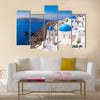 Panoramic scenic view of beautiful white houses and blue domes in Oia, Santorini, Greece Multi Panel Canvas Wall Art