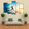 Surfer on Blue Ocean Wave Getting Barreled at Sunrise Multi Panel Canvas Wall Art