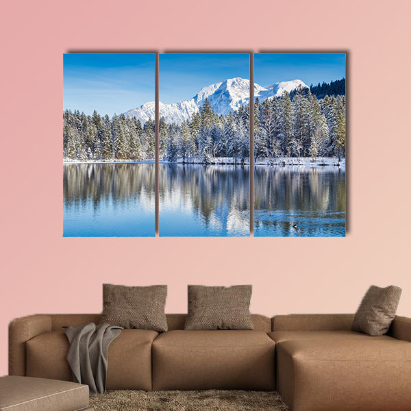 Idyllic winter wonderland with crystal clear mountain lake wall art