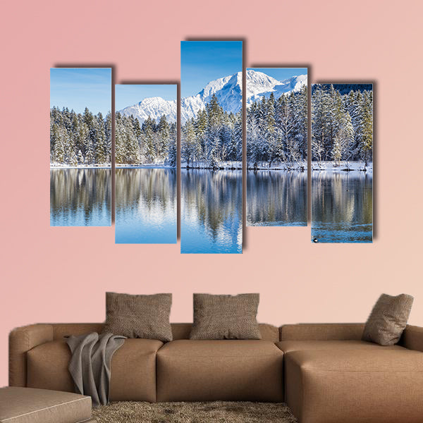 Idyllic winter wonderland with crystal clear mountain lake wall art