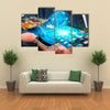 Businessman with modern mobile phone in his hand switching pictures Multi panel canvas wall art