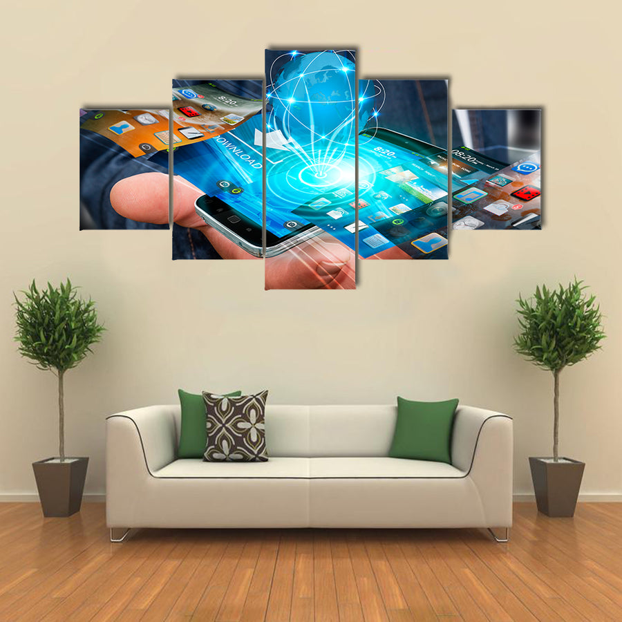 Businessman with modern mobile phone in his hand switching pictures Multi panel canvas wall art