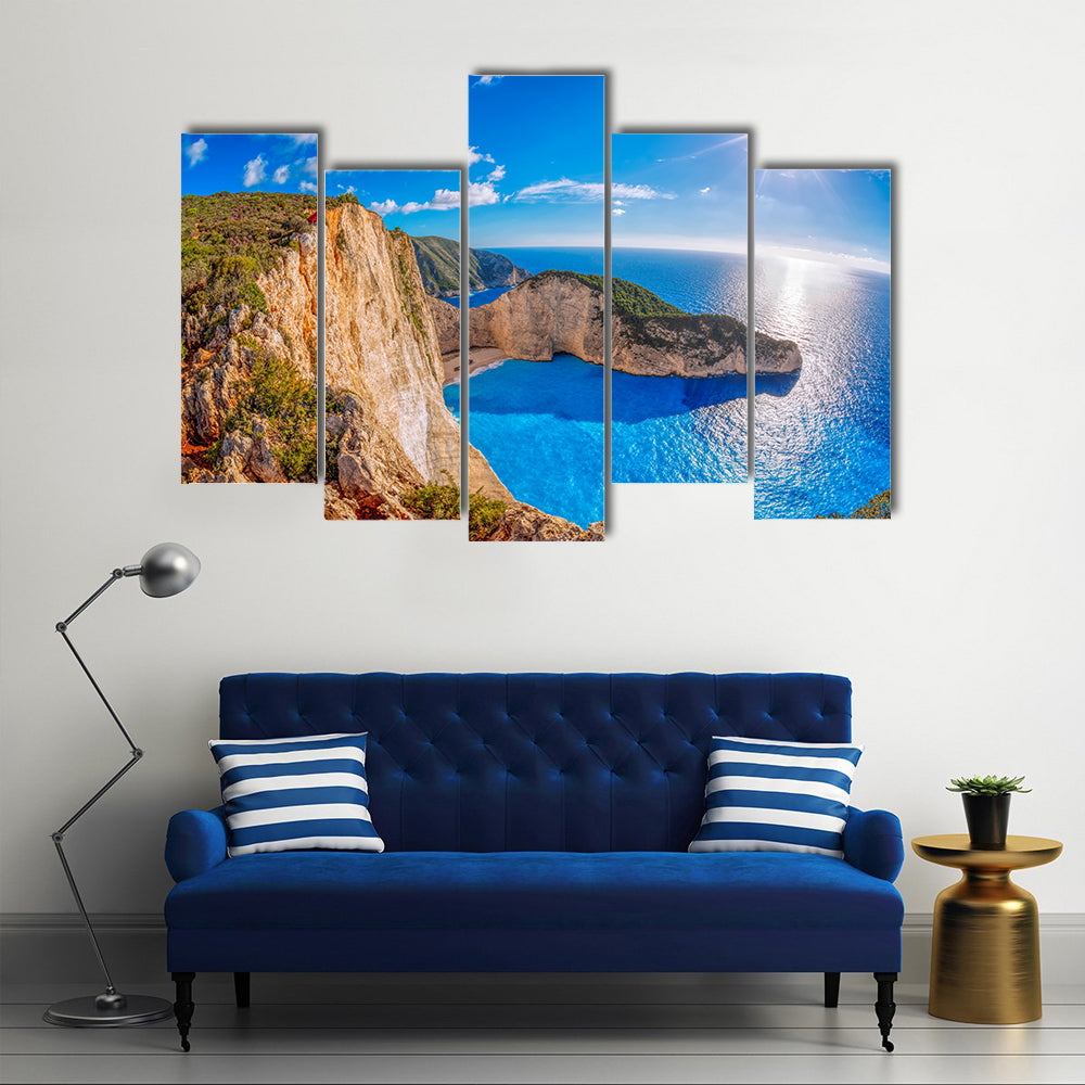 Navagio beach with shipwreck against sunset on Zakynthos Island in Greece Multi Panel Canvas Wall Art
