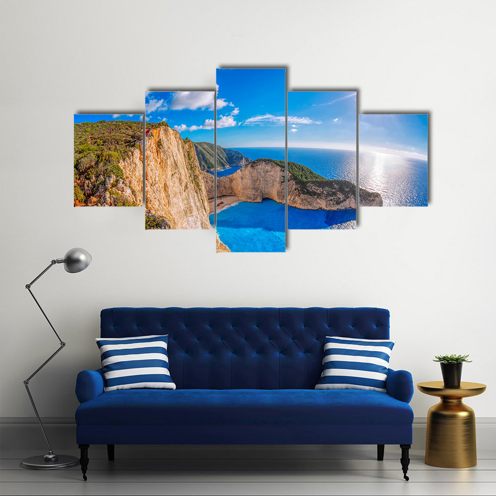Navagio beach with shipwreck against sunset on Zakynthos Island in Greece Multi Panel Canvas Wall Art