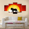 Lonesome lion in a sunset of the sahara desert Multi panel canvas wall art