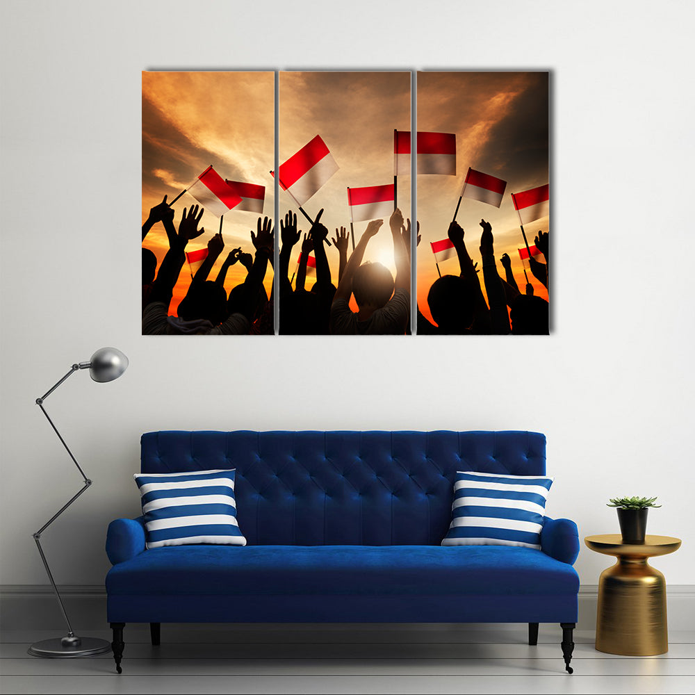 Silhouettes of People Holding the Flag of Indonesia Multi panel canvas wall art
