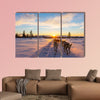 Musher and passenger in a dog sleigh with huskies a cold wall art