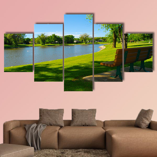 Park bench overlooking a lake multi panel canvas wall art