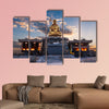 The sun rises behind a Buddha statue in Busan, South Korea multi panel canvas wall art