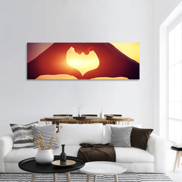 Heart shape making of hands panoramic canvas wall art.