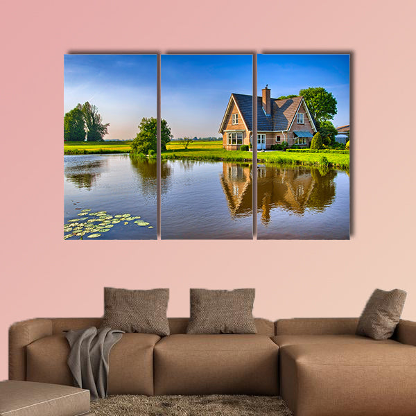 Red bricks house in countryside near the lake multi panel canvas wall art