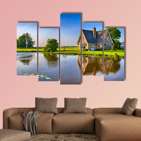Red bricks house in countryside near the lake multi panel canvas wall art