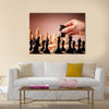 Male hand moving the black chess knight multi panel canvas wall art