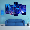 Welding robots movement in a car factory multi panel canvas wall art