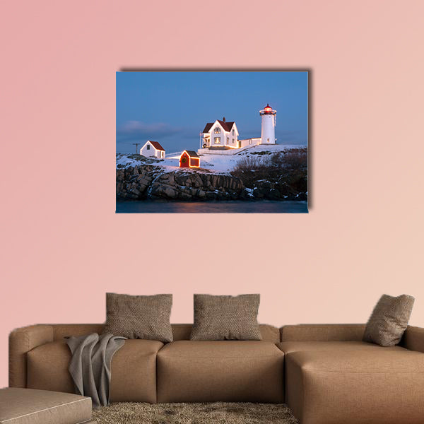 Southern Maine's Nubble lighthouse lit at dusk during the holidays