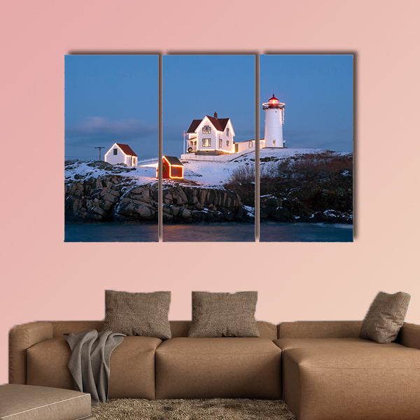 Southern Maine's Nubble lighthouse lit at dusk during the holidays