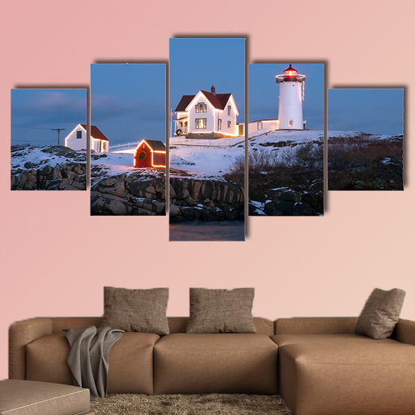 Southern Maine's Nubble lighthouse lit at dusk during the holidays