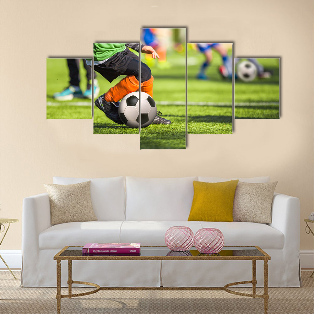 Football training for children Multi panel canvas wall art