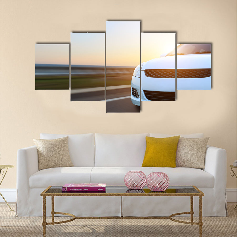 Movement car speed on asphalt at sunset Multi panel canvas wall art