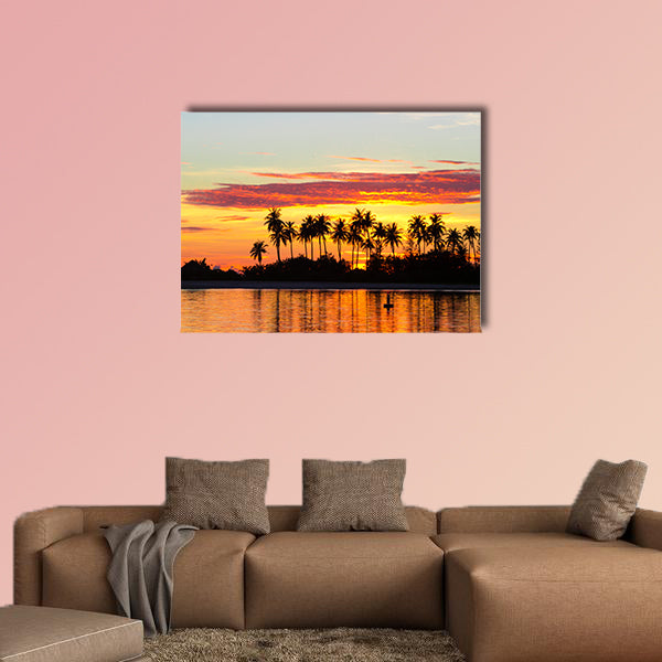 Sunset at the seaside with dark silhouettes of palm trees multi panel canvas wall art