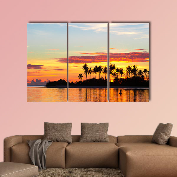 Sunset at the seaside with dark silhouettes of palm trees multi panel canvas wall art