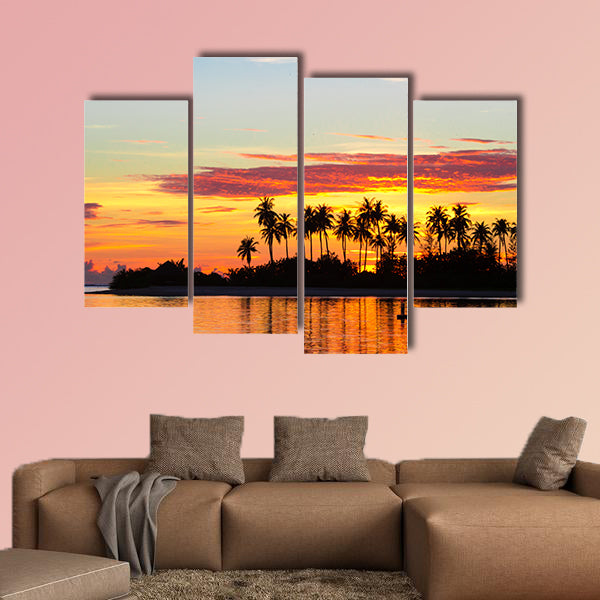 Sunset at the seaside with dark silhouettes of palm trees multi panel canvas wall art
