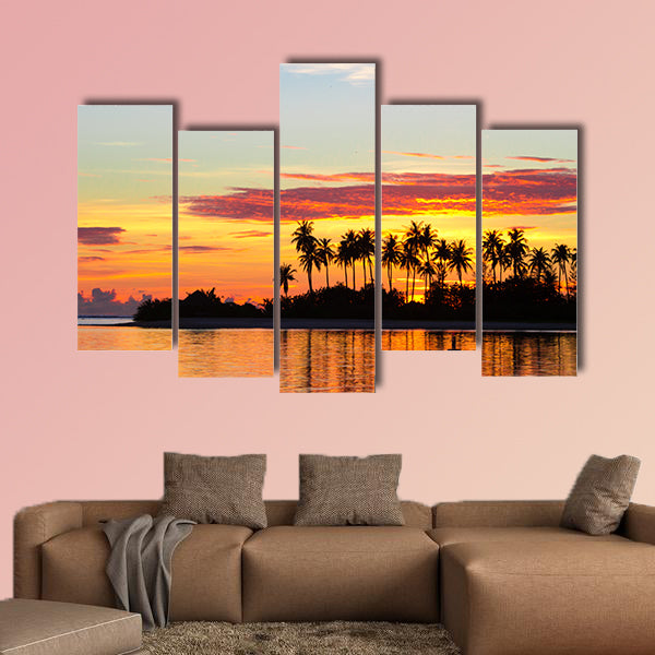 Sunset at the seaside with dark silhouettes of palm trees multi panel canvas wall art