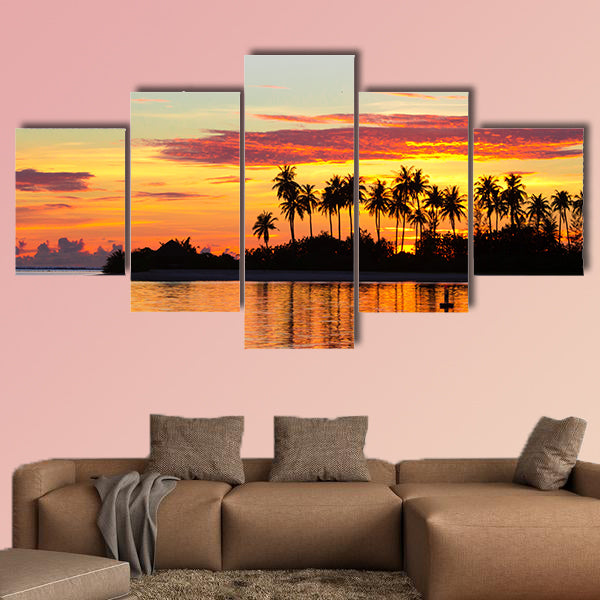 Sunset at the seaside with dark silhouettes of palm trees multi panel canvas wall art
