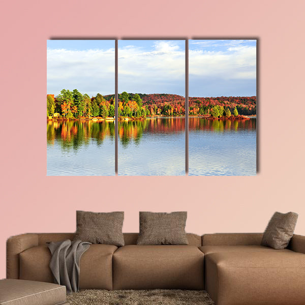 Forest of colorful autumn trees reflecting in calm lake Multi panel canvas wall art