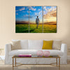 One man and field of spring grass and sunset, Multi panel canvas wall art