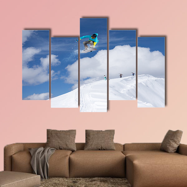 Flying snowboarder on mountains. Extreme winter sport Multi panel canvas wall art