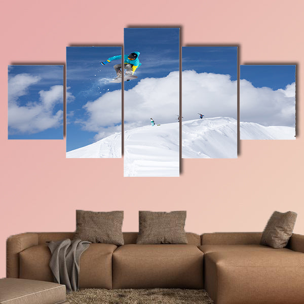 Flying snowboarder on mountains. Extreme winter sport Multi panel canvas wall art