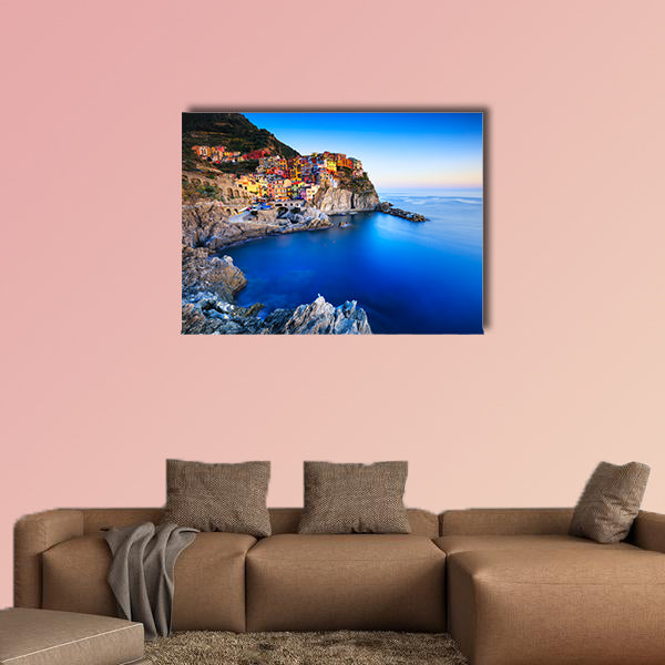 Manarola village on cliff rocks and sea at sunset multi panel canvas wall art