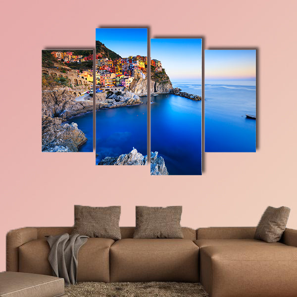 Manarola village on cliff rocks and sea at sunset multi panel canvas wall art