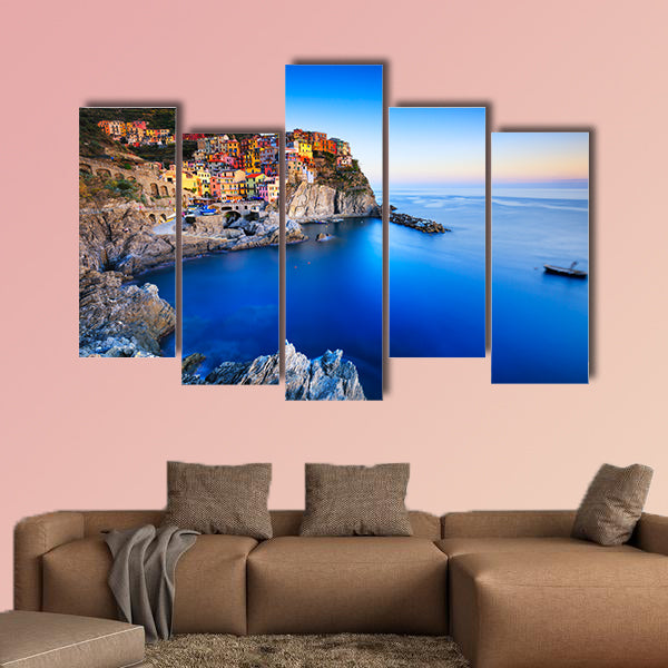 Manarola village on cliff rocks and sea at sunset multi panel canvas wall art