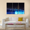 Illuminated fountain at night in modern city Kuala Lumpur  multi panel canvas wall art