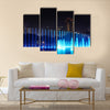 Illuminated fountain at night in modern city Kuala Lumpur  multi panel canvas wall art