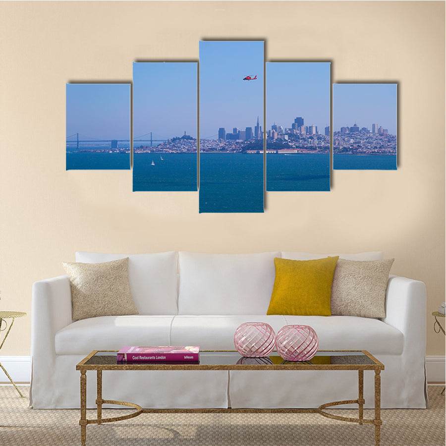 A helicopter flying over the Bay area in SanFrancisco with blue sky on a sunny day In California, USA, Multi Panel Canvas Wall Art