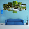 A Mountain stream in a tropical rain forest multi panel canvas wall art