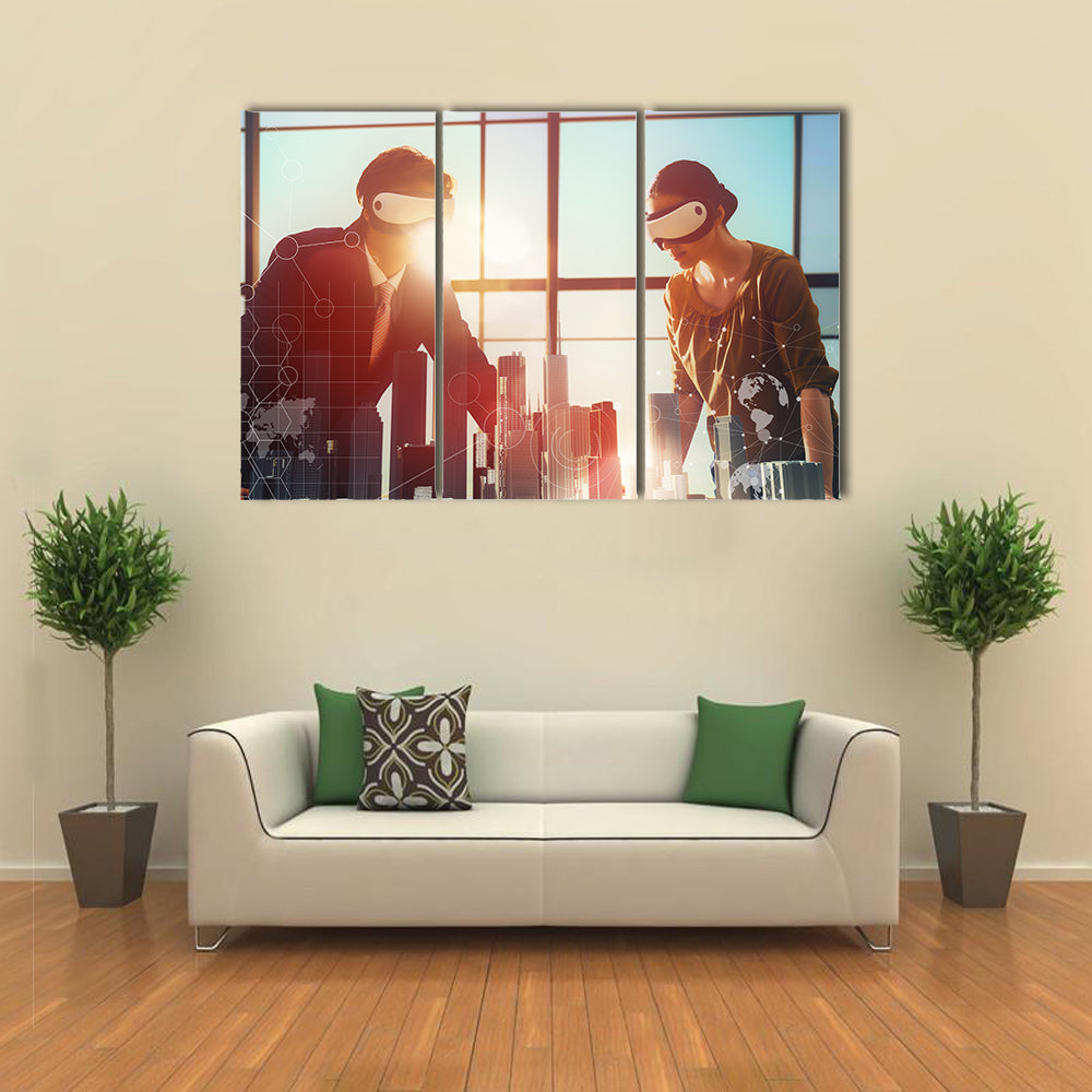Two business persons are developing a project using virtual reality goggles Multi panel canvas wall art