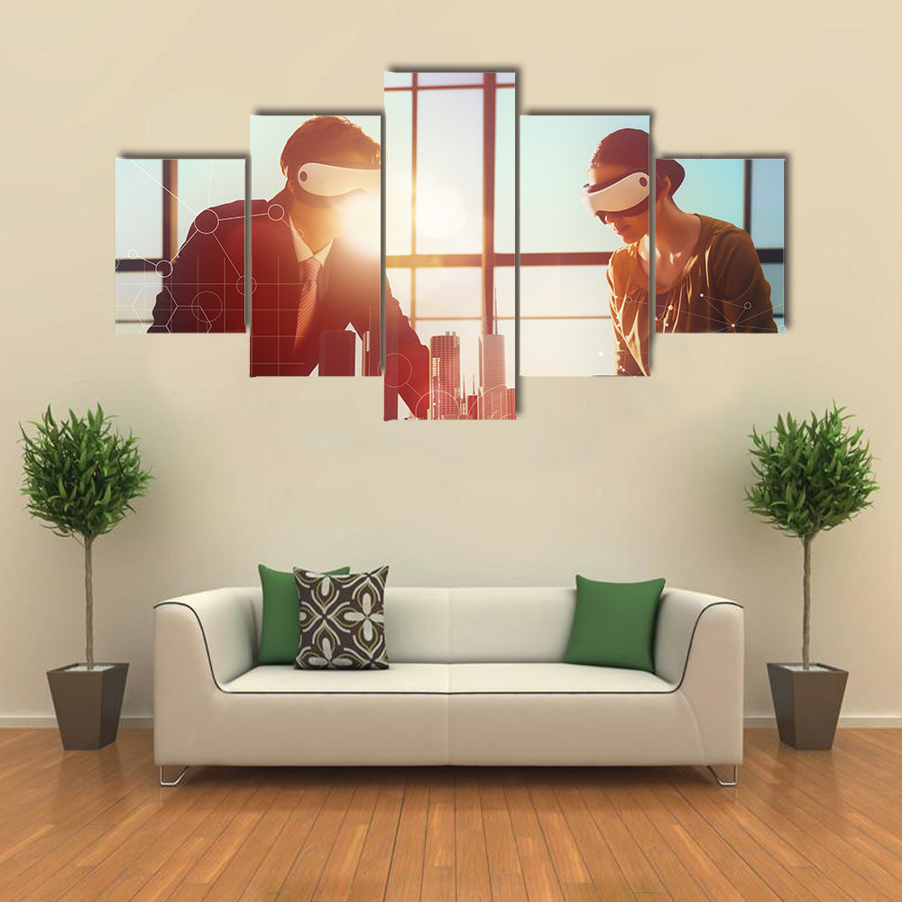 Two business persons are developing a project using virtual reality goggles Multi panel canvas wall art