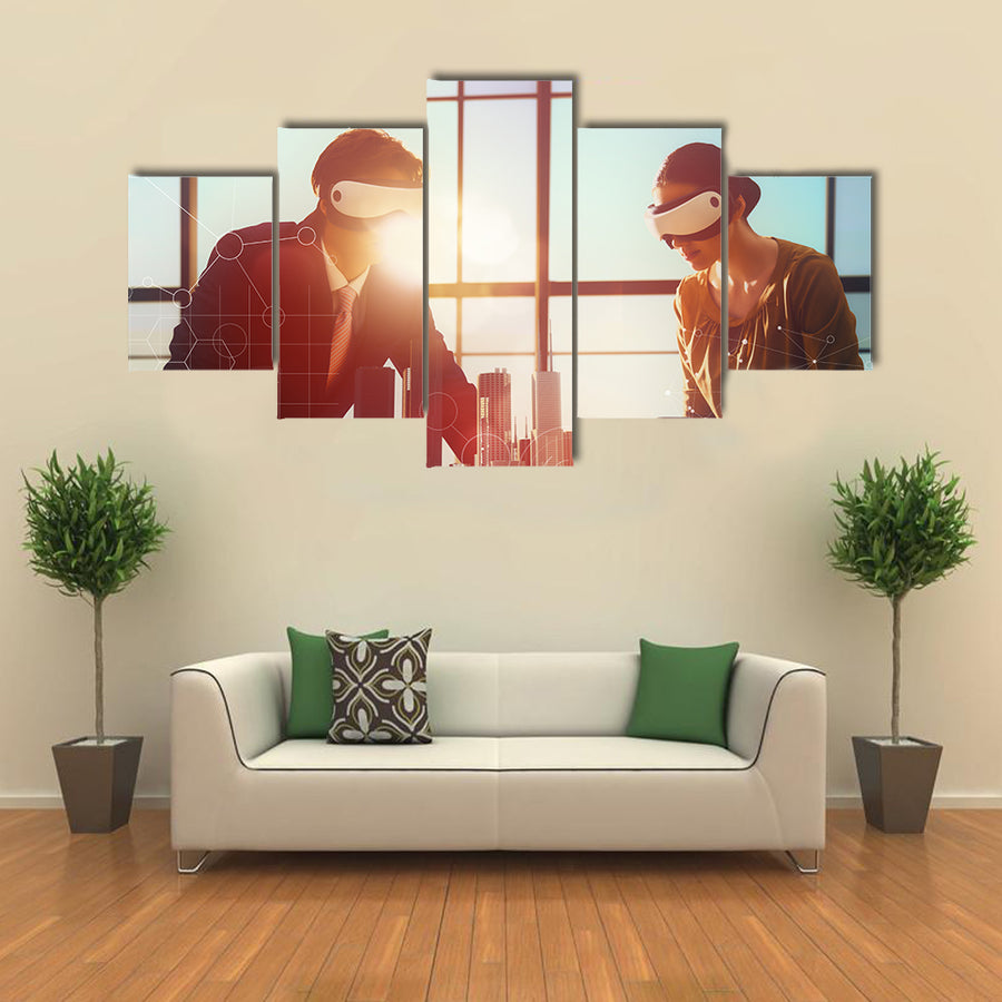 Two business persons are developing a project using virtual reality goggles Multi panel canvas wall art