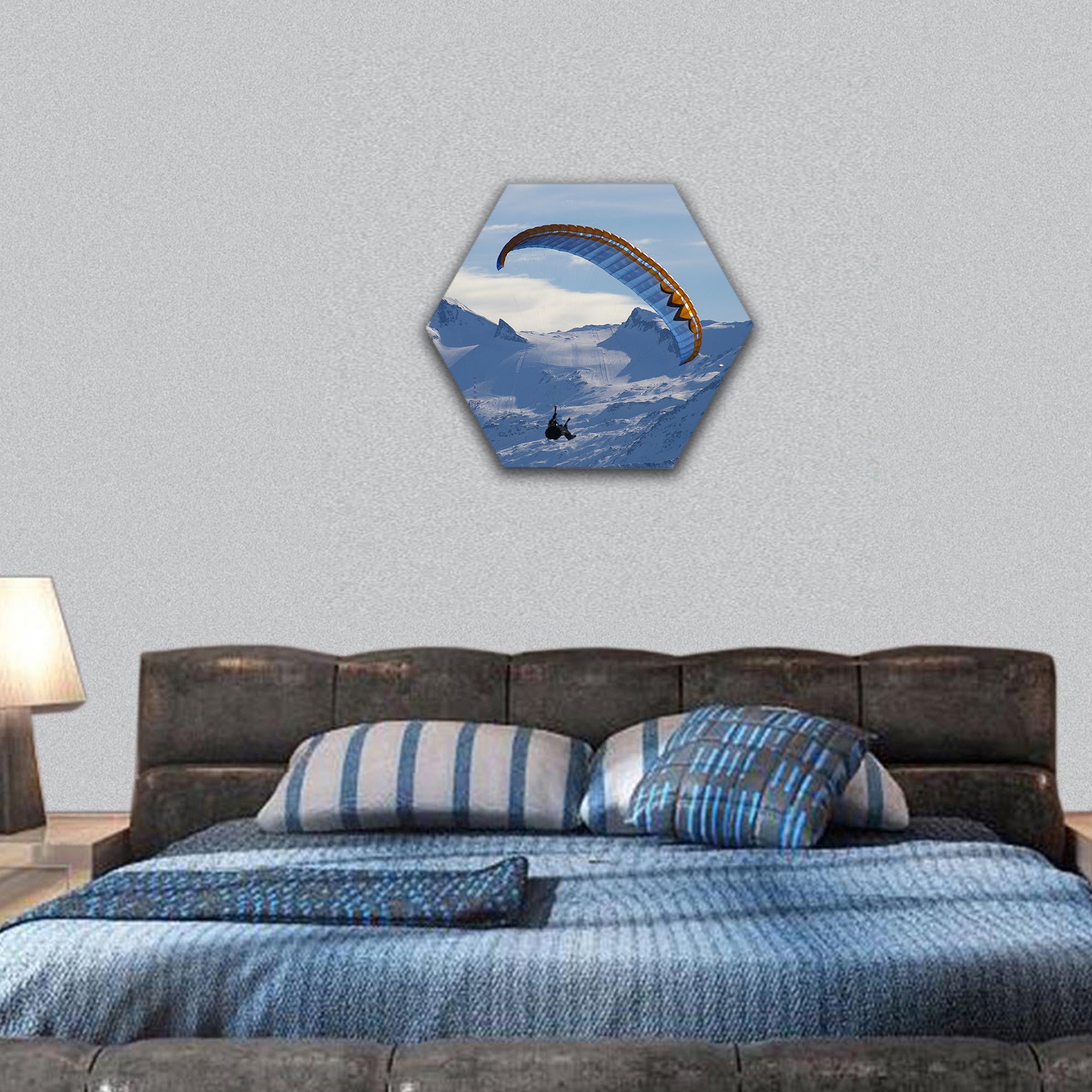 Paragliding over mountain in winter hexagonal canvas wall art