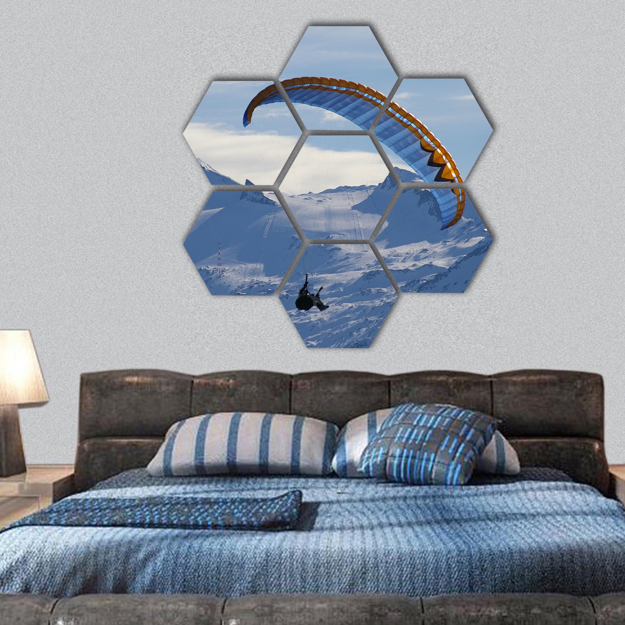 Paragliding over mountain in winter hexagonal canvas wall art