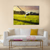 Golf ball on tee in front of driver Multi Panel Canvas Wall Art