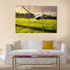 Golf ball on tee in front of driver Multi Panel Canvas Wall Art