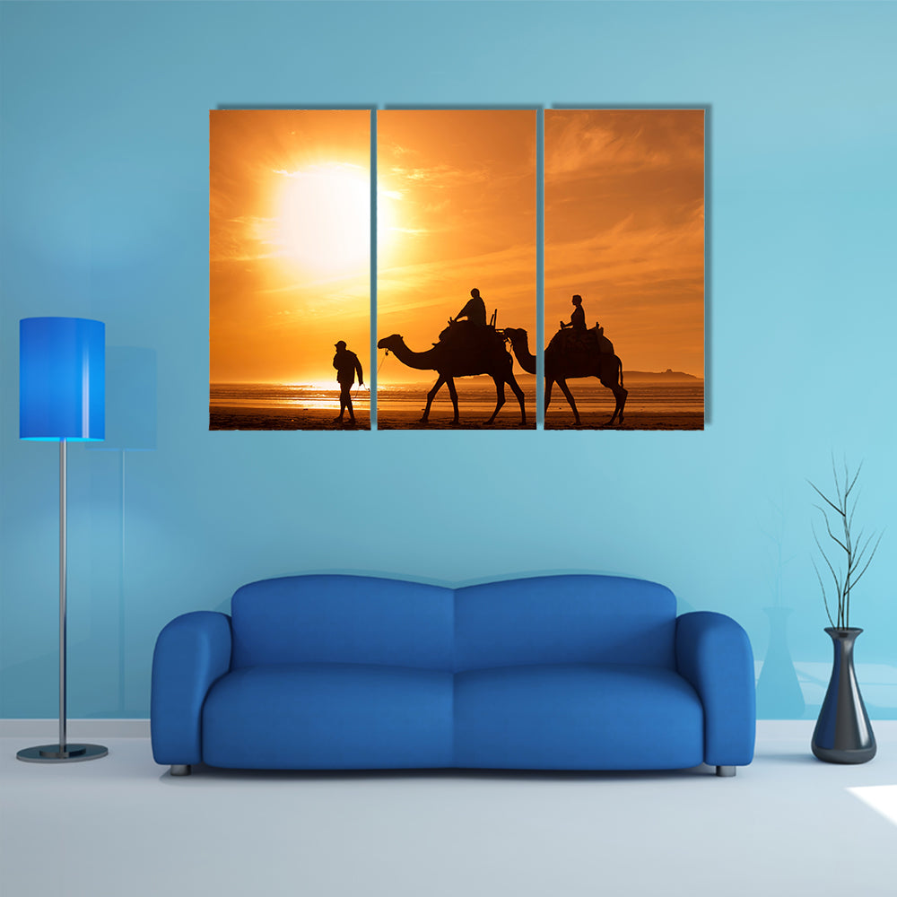 Silhouettes of camels at sunset multi panel canvas wall art