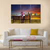 A man looking at the cityscape of Kuwait Multi Panel Canvas Wall Art